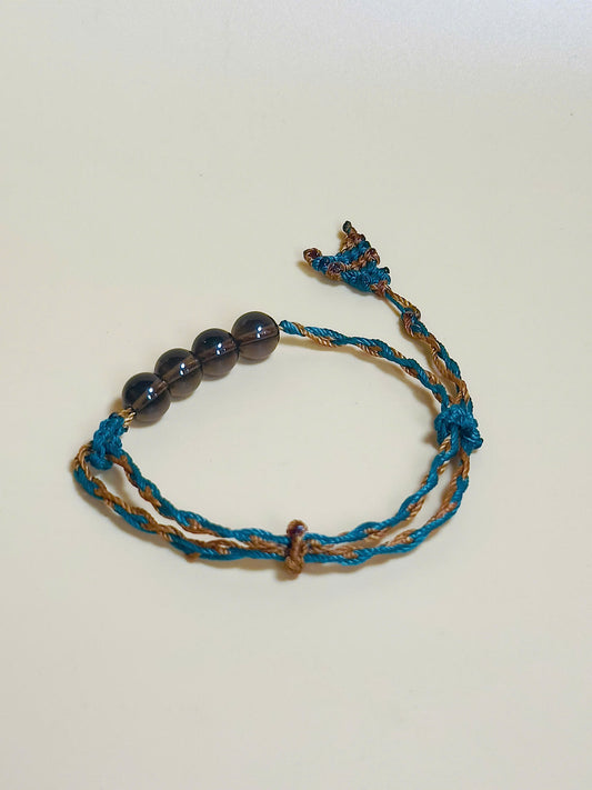 Smoky quartz bracelet in earthy tones with handmade whale tail knot