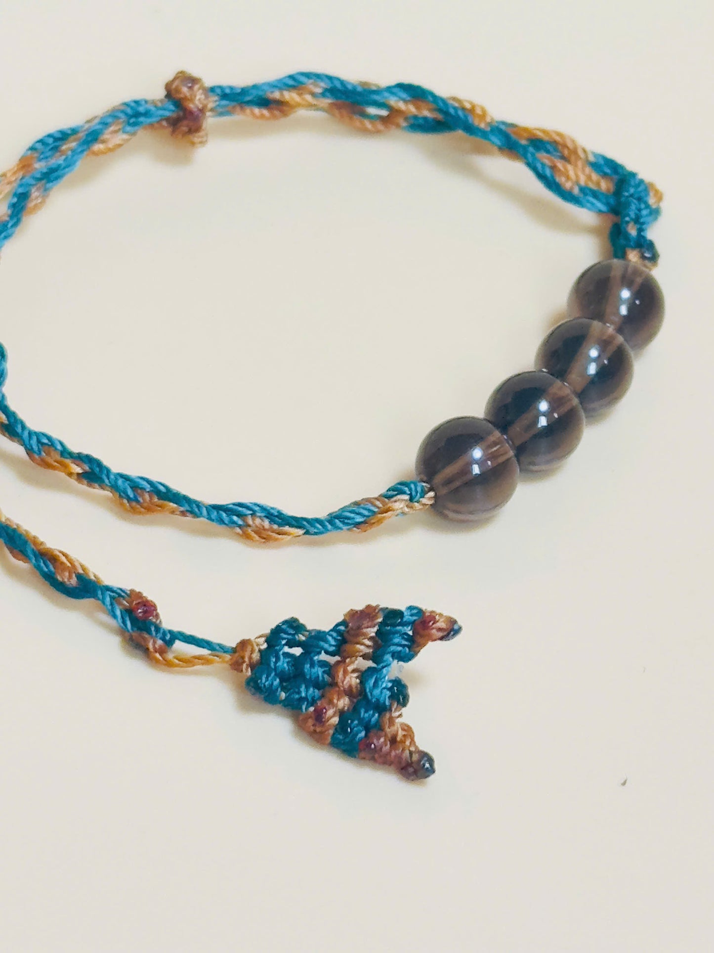 Smoky quartz bracelet in earthy tones with handmade whale tail knot