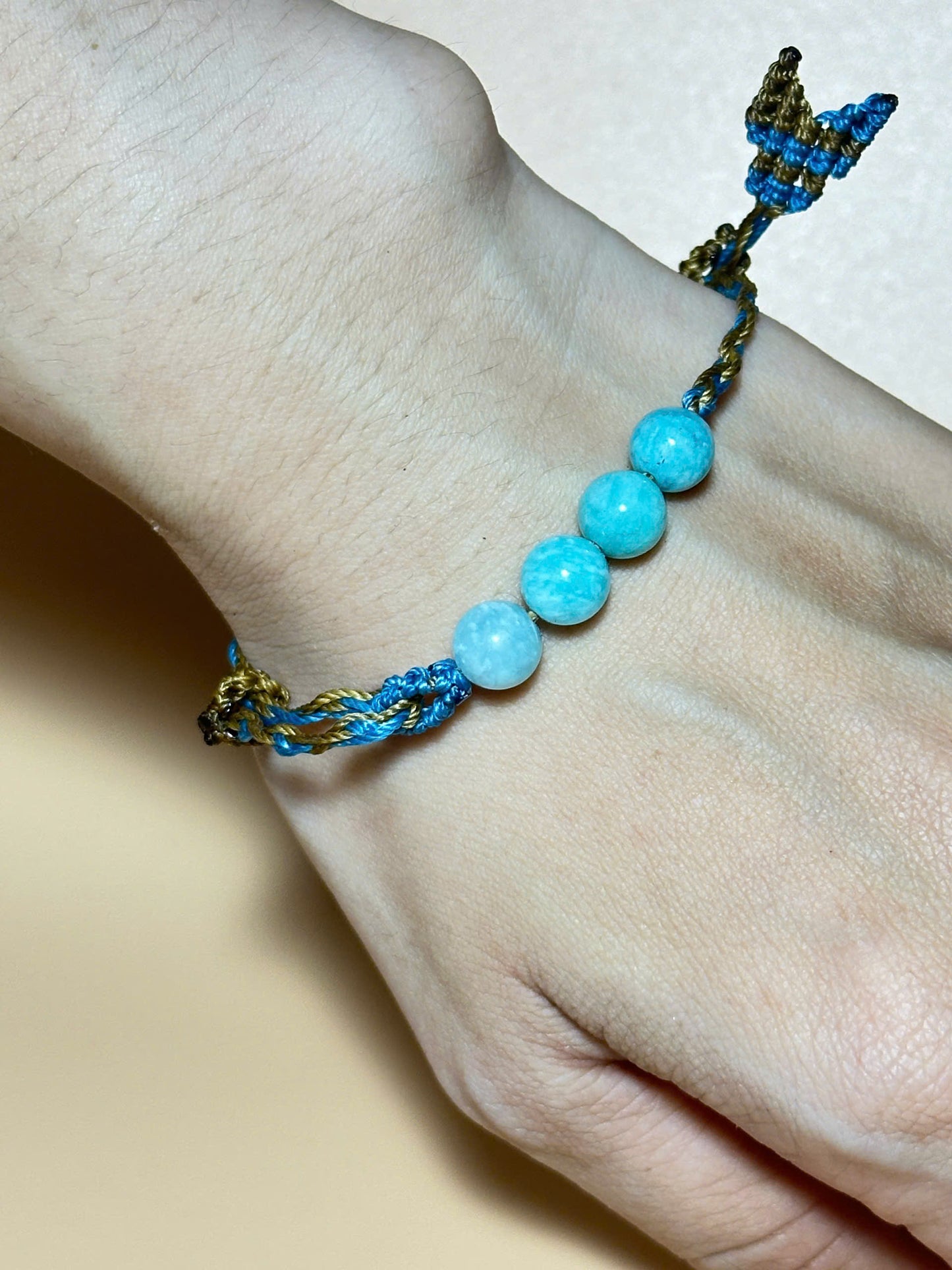 Aquamarine bracelet with soft blue tones and whale tail knot