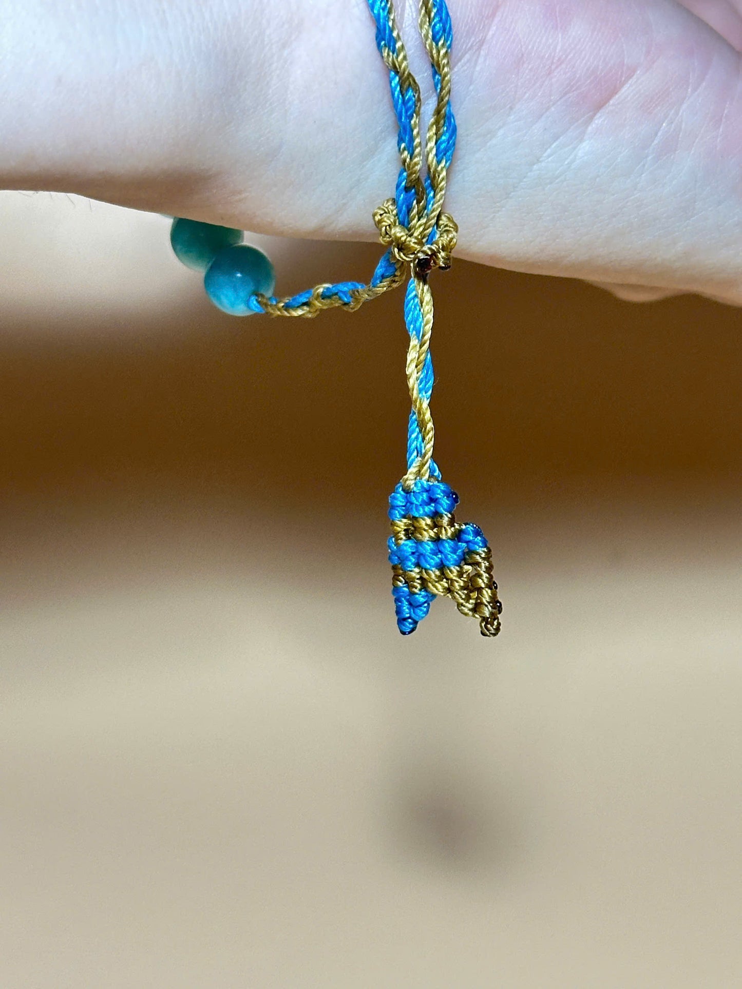 Aquamarine bracelet with soft blue tones and whale tail knot