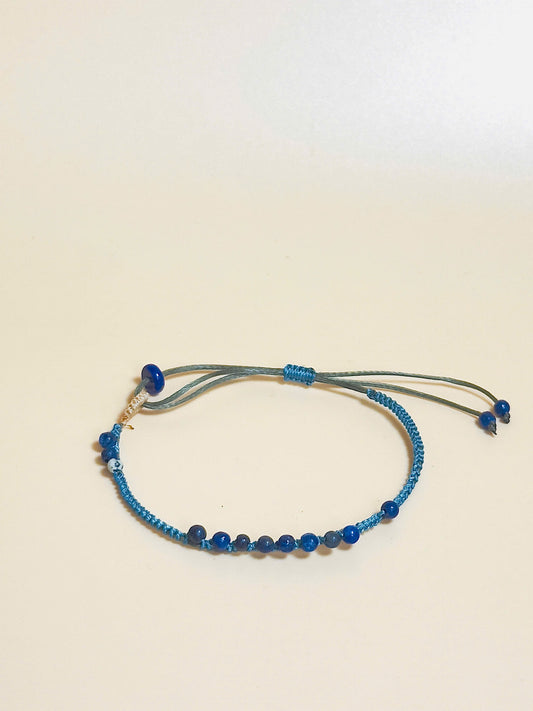 “Blue lapis lazuli bracelet with 2.5mm gemstone beads and waxed adjustable cord – calming and minimal design”
