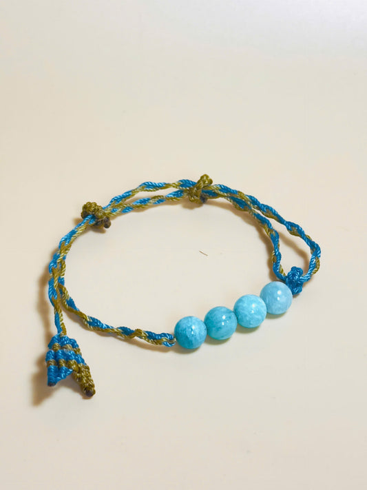 Aquamarine bracelet with soft blue tones and whale tail knot
