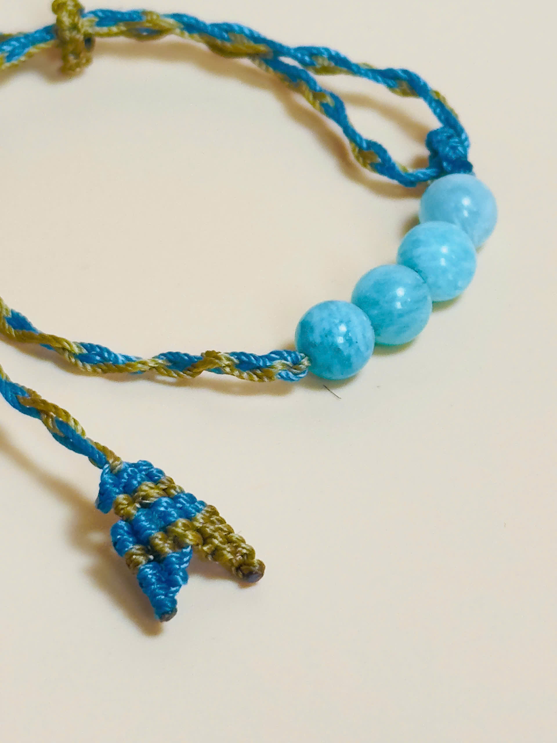 Aquamarine bracelet with soft blue tones and whale tail knot