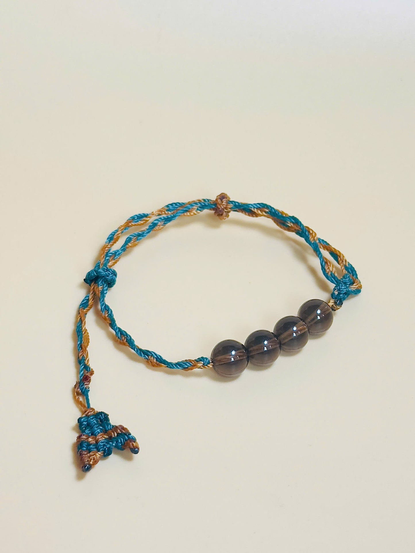 Smoky quartz bracelet in earthy tones with handmade whale tail knot