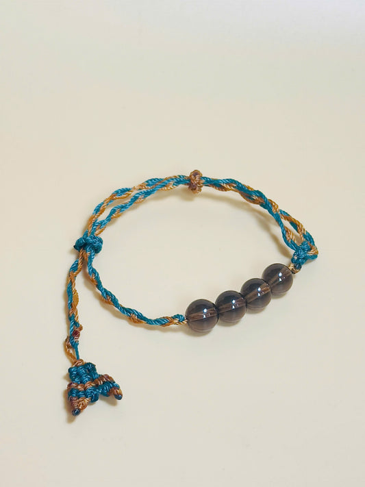 Smoky quartz bracelet in earthy tones with handmade whale tail knot