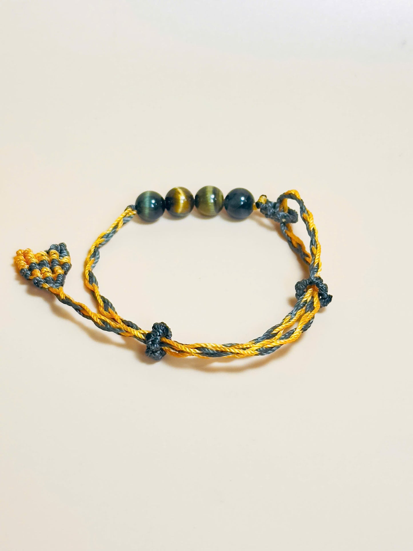Golden brown Tiger’s Eye bracelet with whale tail macrame closure