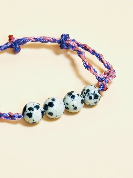 Dalmatian jasper bracelet with spotted stones and whale tail detail