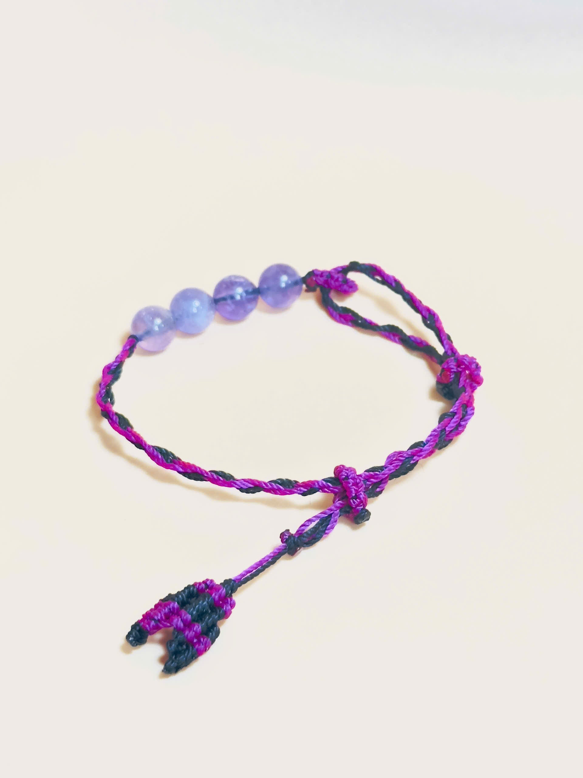 Purple Amethyst bracelet with soft waxed cord and whale tail finish