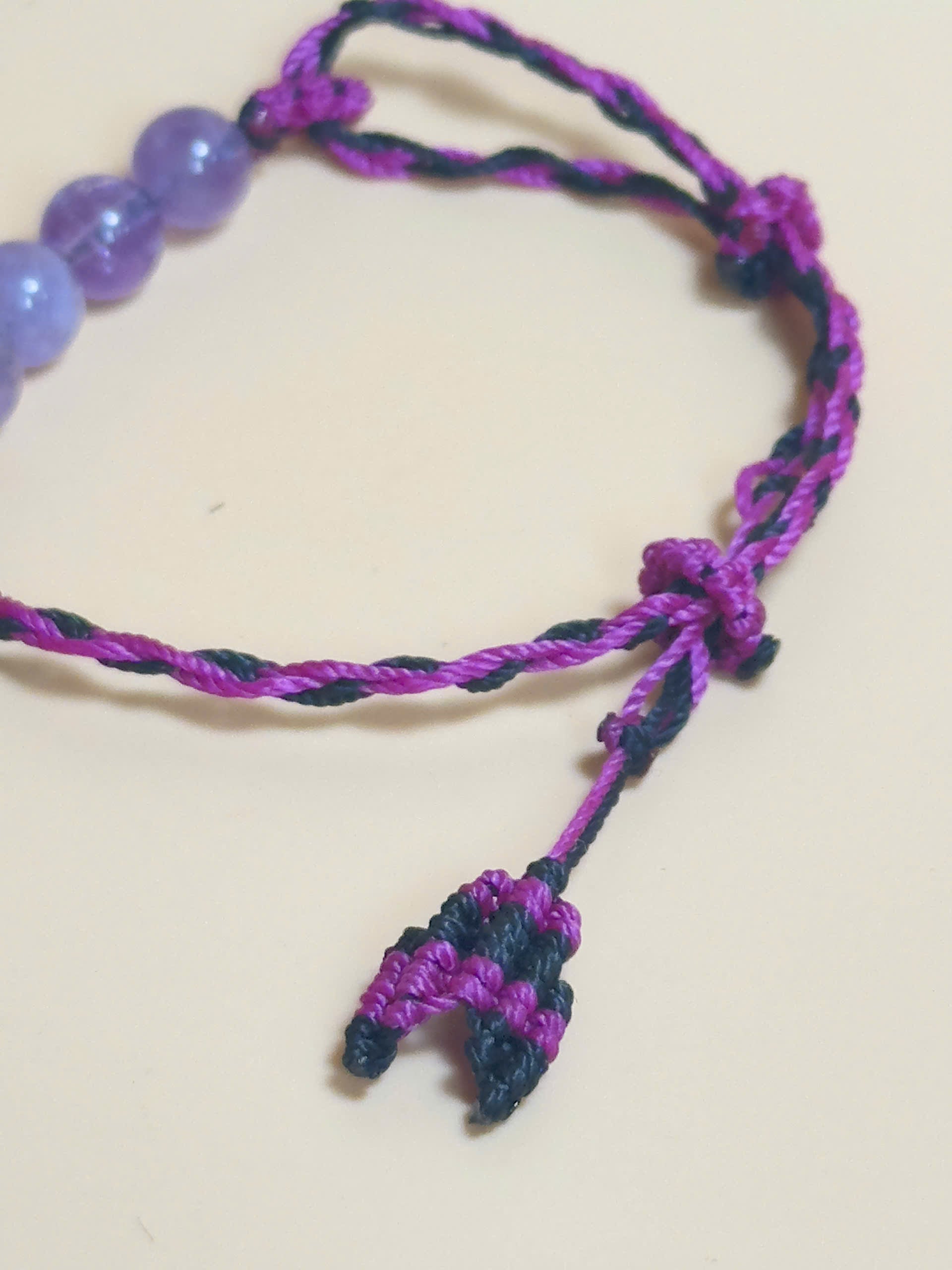 Purple Amethyst bracelet with soft waxed cord and whale tail finish