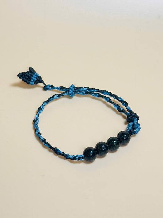 Black obsidian bracelet with whale tail macrame and bold look