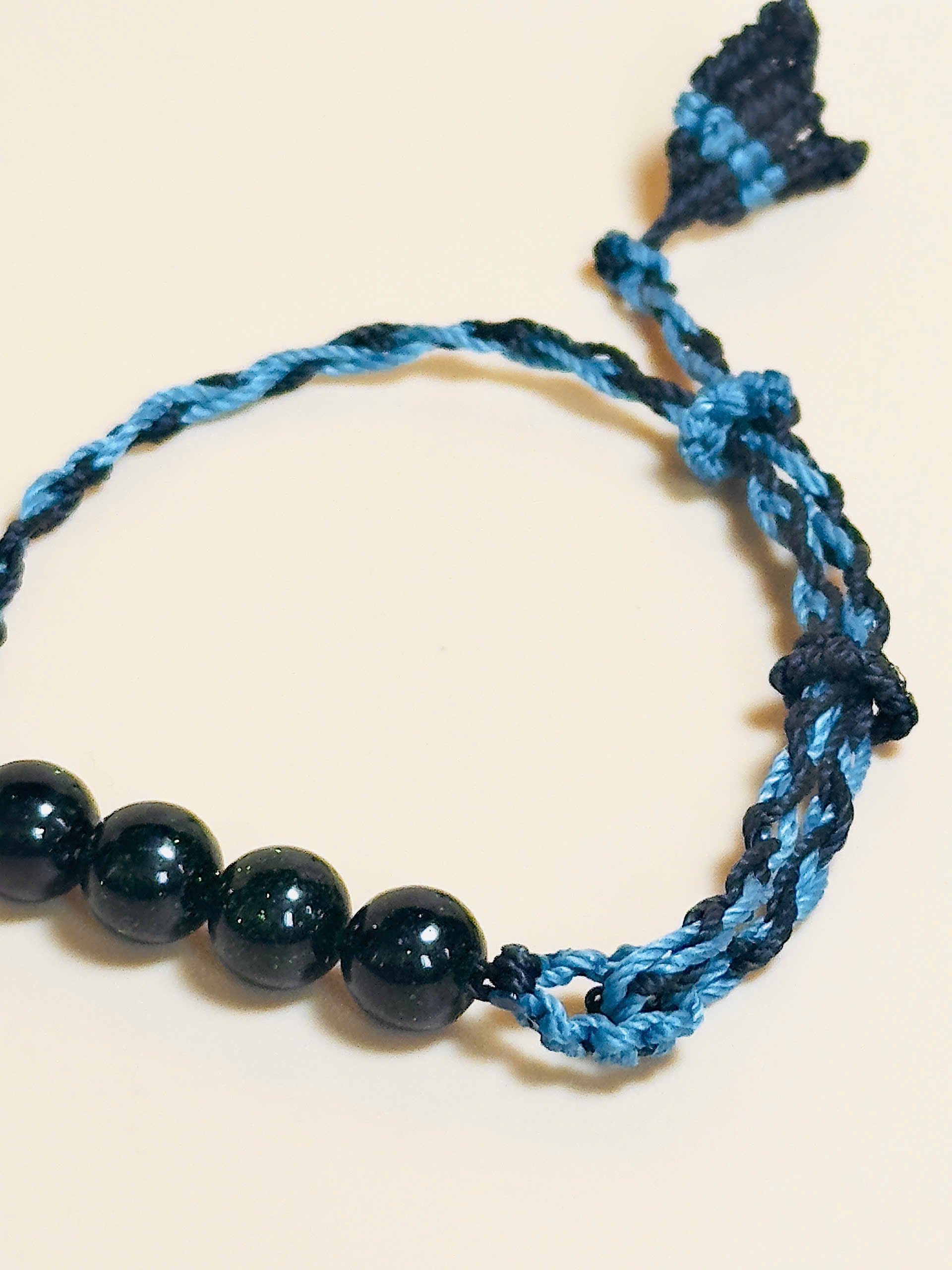 Black obsidian bracelet with whale tail macrame and bold look