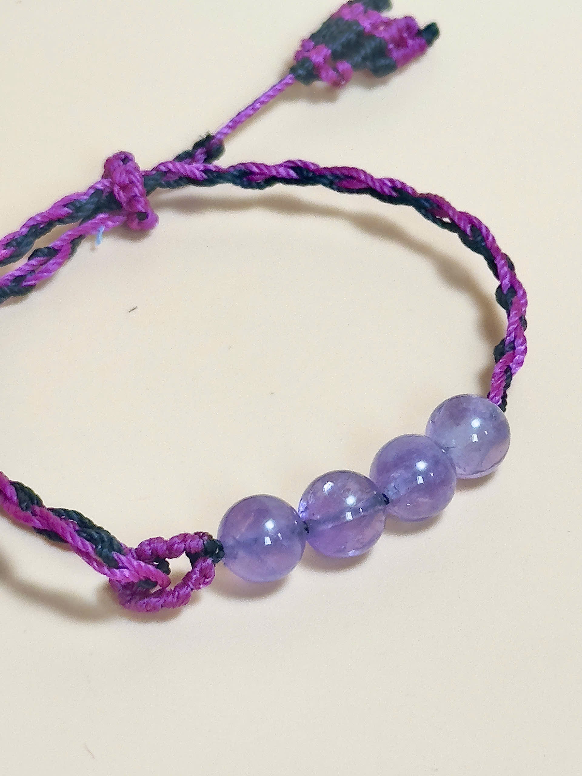 Purple Amethyst bracelet with soft waxed cord and whale tail finish