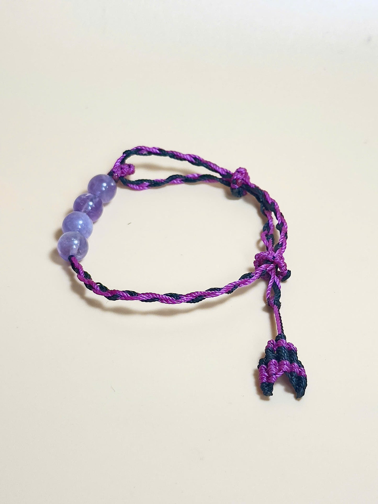 Purple Amethyst bracelet with soft waxed cord and whale tail finish