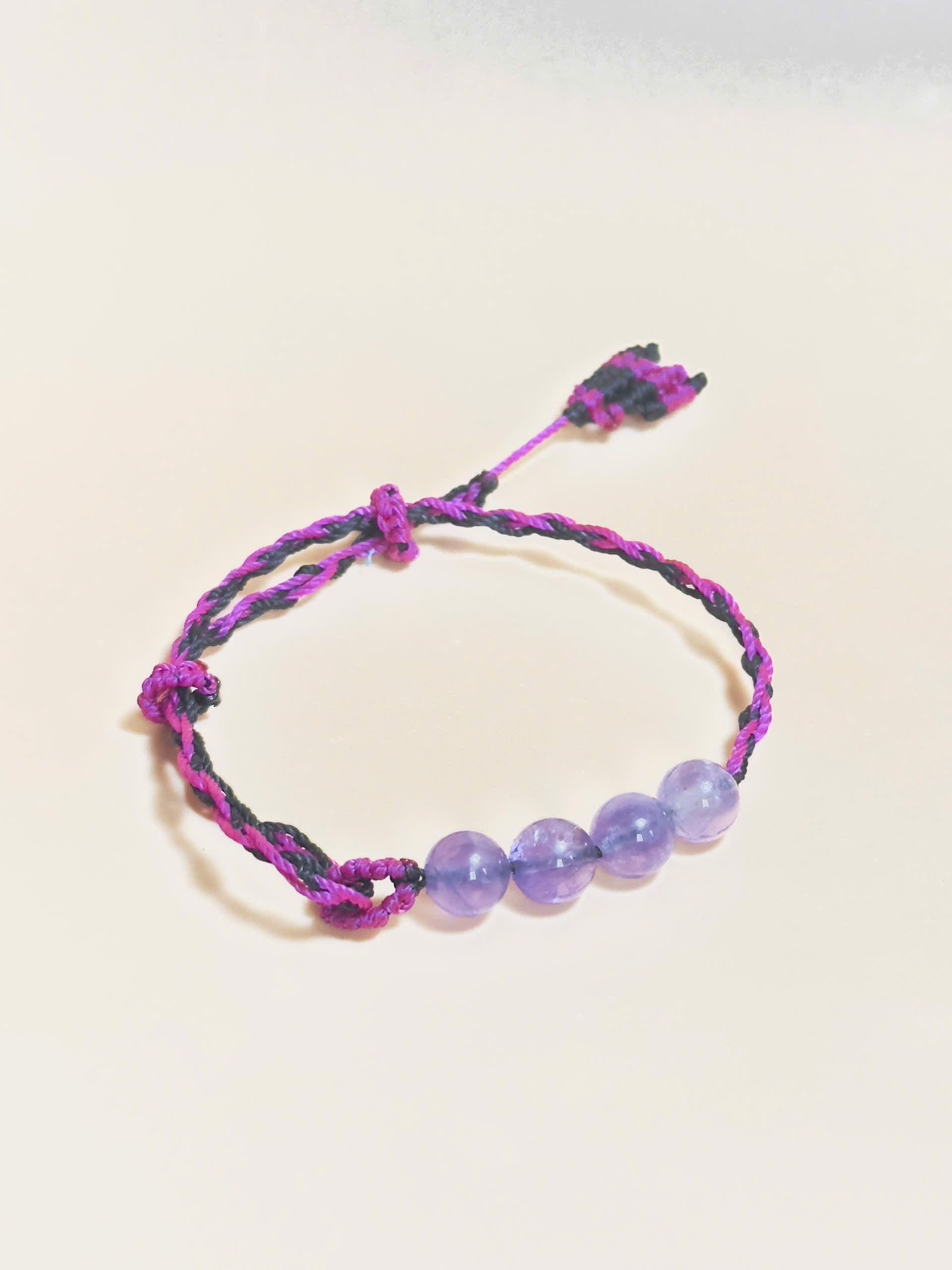 Purple Amethyst bracelet with soft waxed cord and whale tail finish