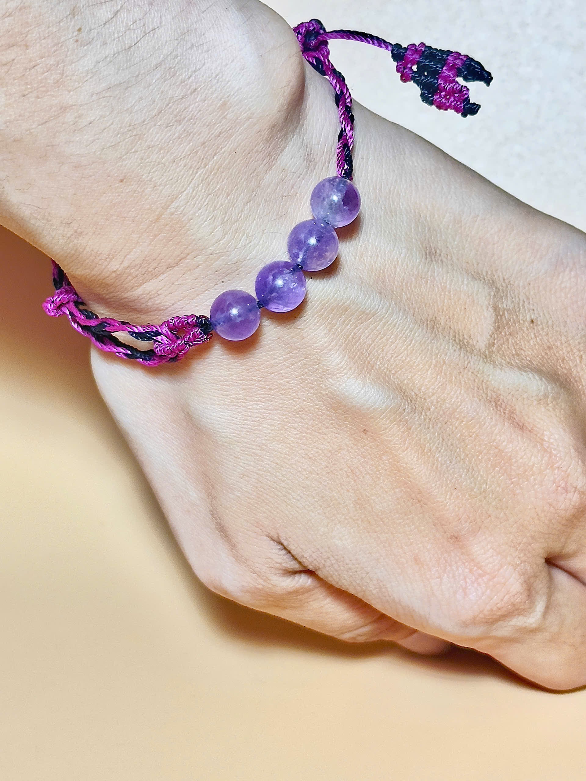 Purple Amethyst bracelet with soft waxed cord and whale tail finish