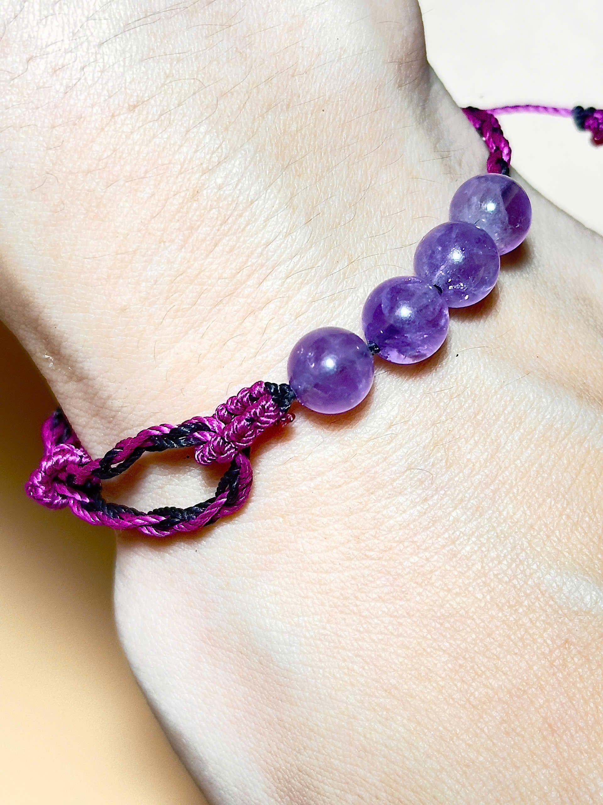Purple Amethyst bracelet with soft waxed cord and whale tail finish
