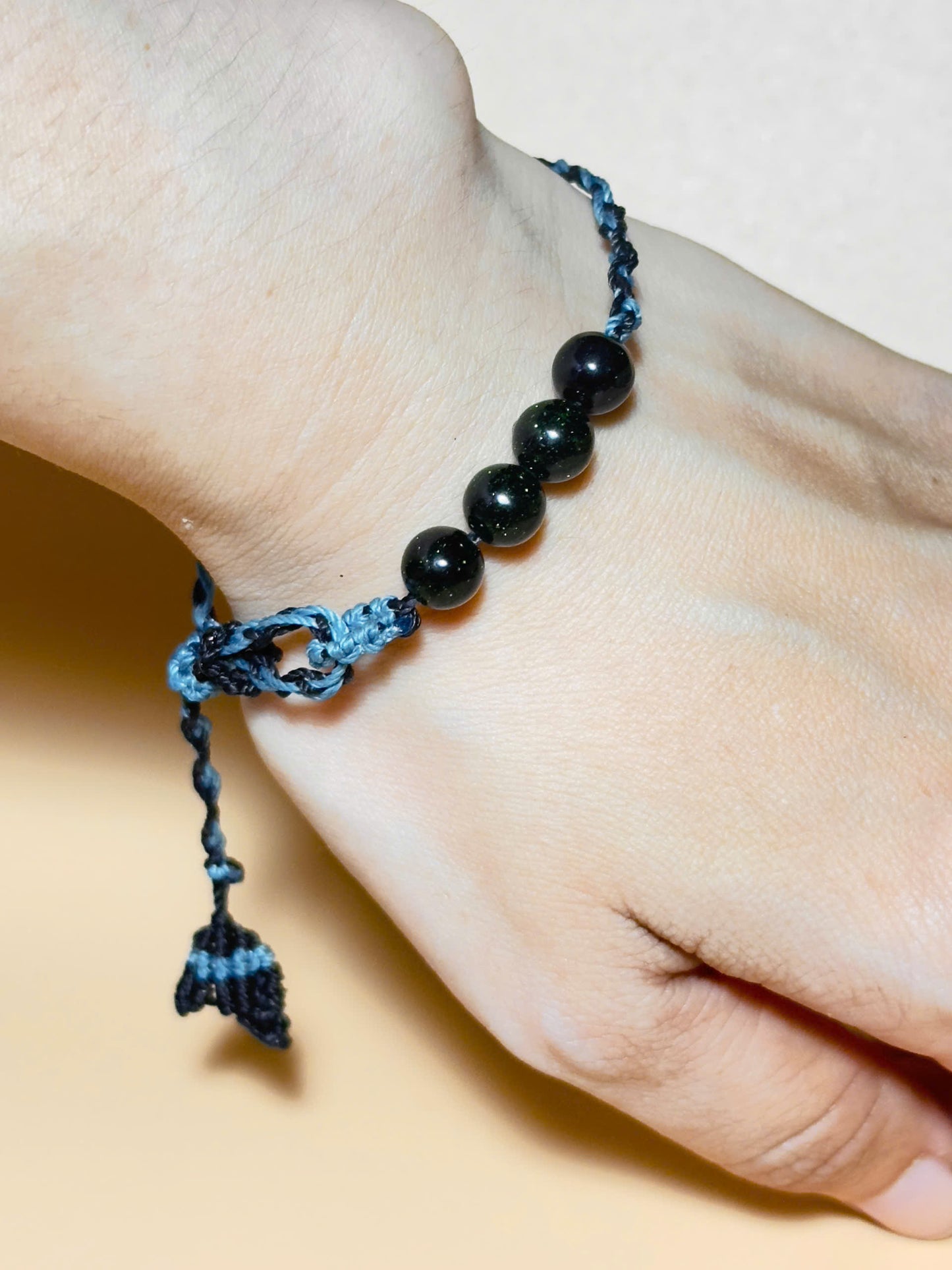 Black obsidian bracelet with whale tail macrame and bold look