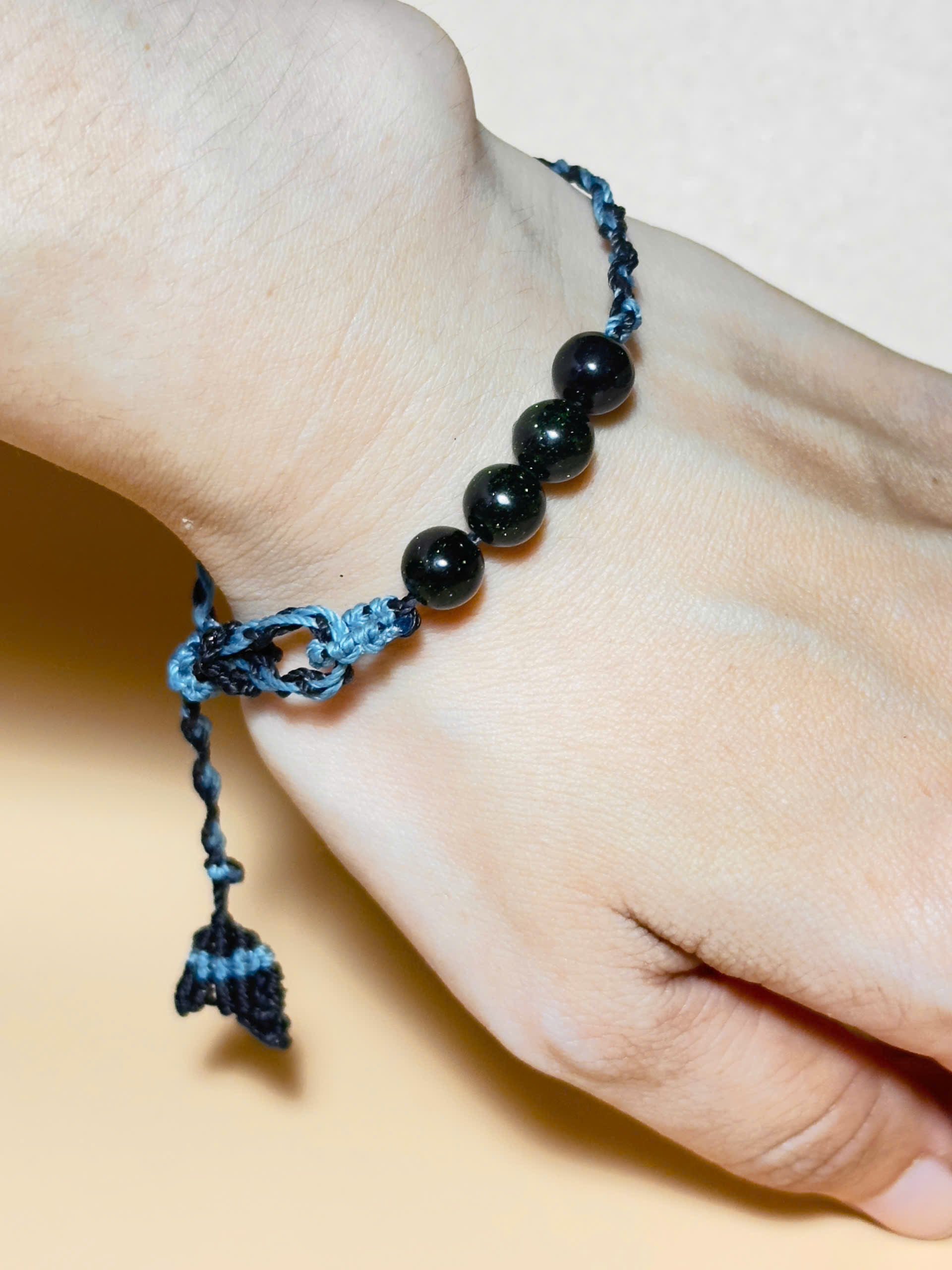 Black obsidian bracelet with whale tail macrame and bold look