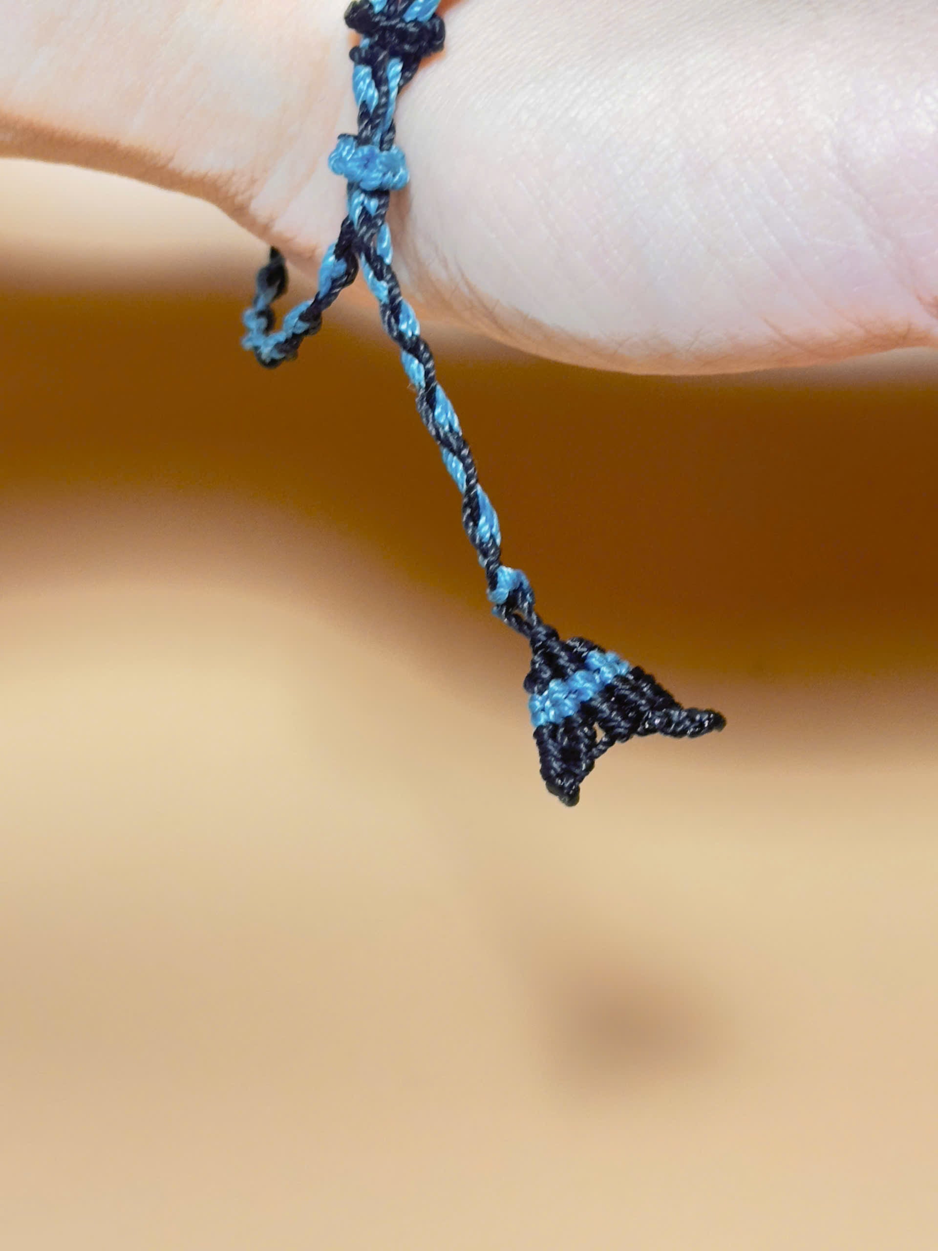 Black obsidian bracelet with whale tail macrame and bold look